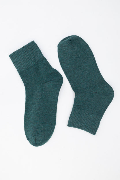Cozy teal ankle socks from Leto Collection featuring a soft knit design, perfect for casual wear and paired with smiley face socks.