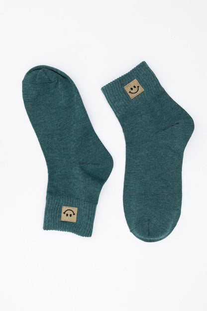 Leto Collection smiley face socks in teal with cozy ribbed cuffs for comfortable wear