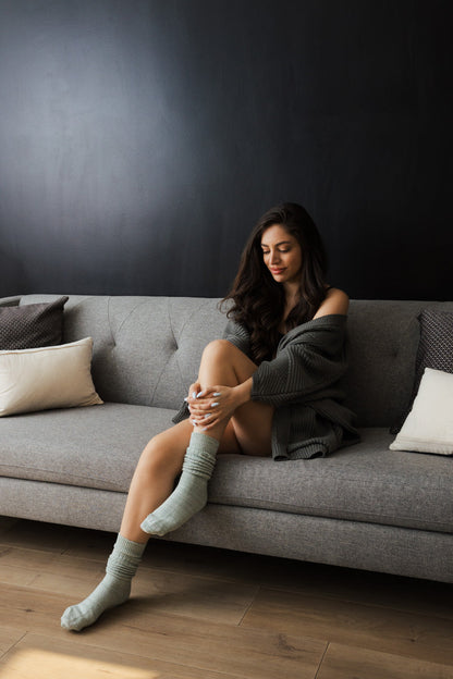 Cozy slouchy knit socks for women in soft green, perfect for relaxing at home