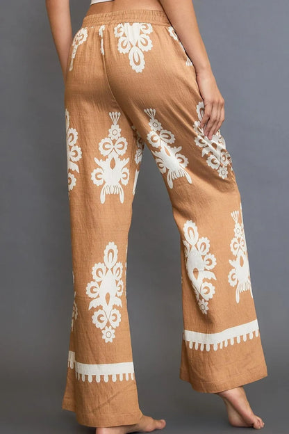 Plus size boho wide leg pants in a tan color with white patterns for stylish and comfortable everyday wear
