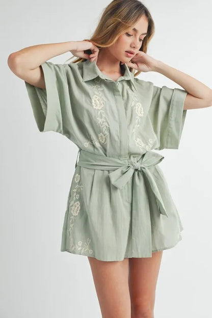 Trendsi embroidered button down romper in soft green with floral designs and a belted waist