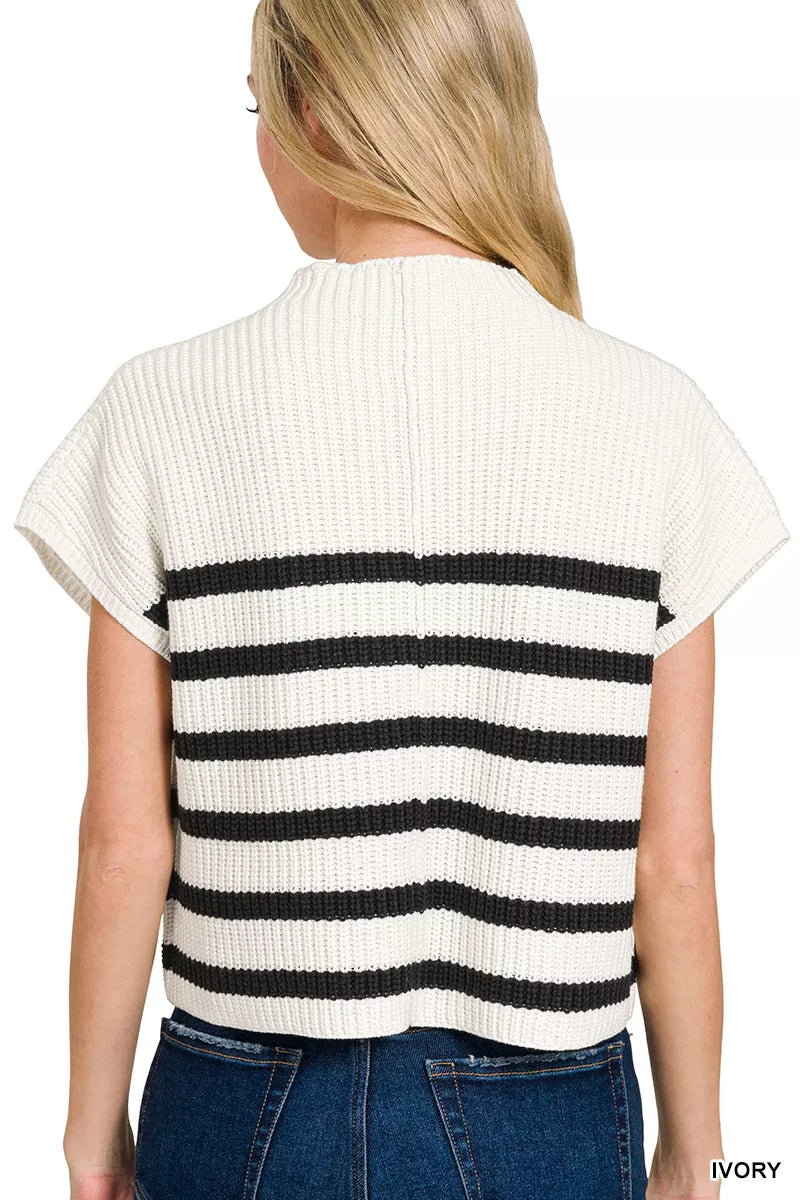 Back view of a boho striped sweater top in ivory and black with a relaxed fit