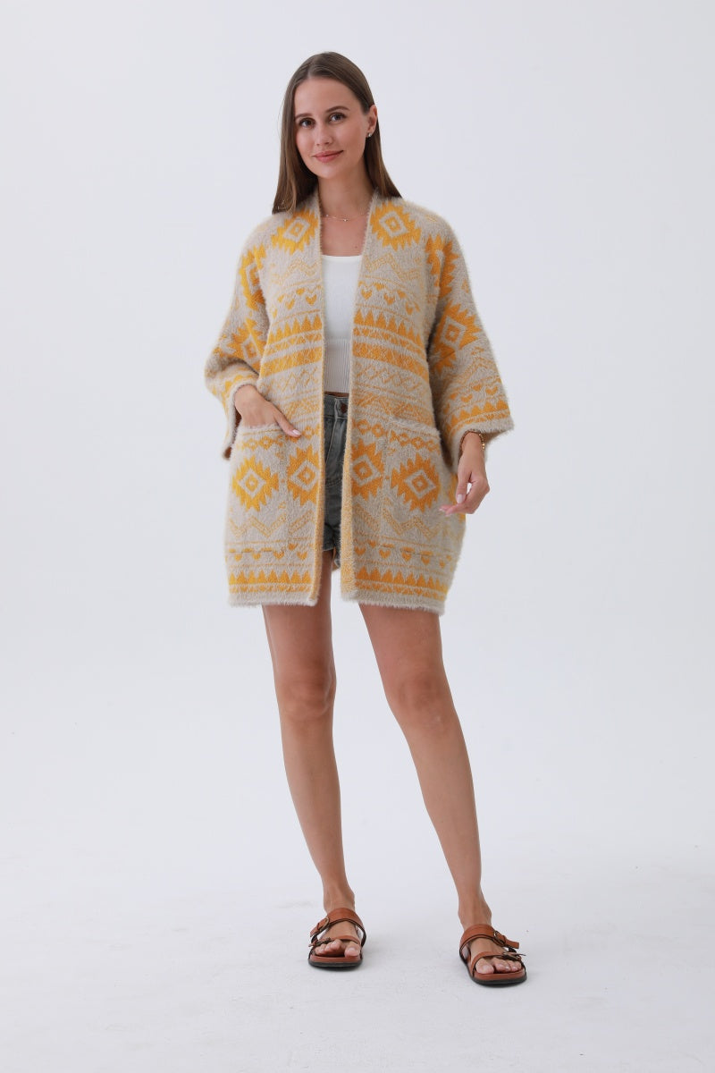 Leto Collection Aztec print knit cardigan in yellow and cream, featuring pockets and a cozy design
