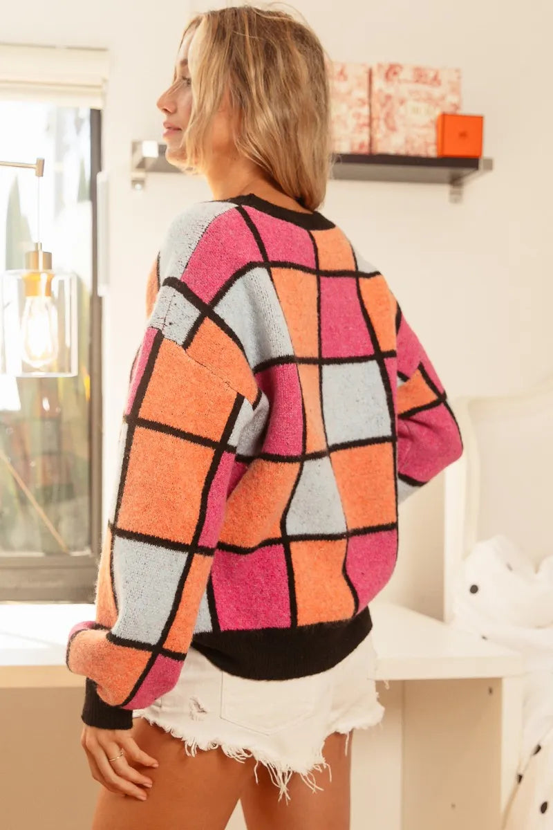 Trendy multi color checker sweater with a vibrant pattern, perfect for stylish casual wear