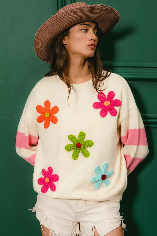 Colorful floral sweater for women with vibrant flower appliques and striped sleeves