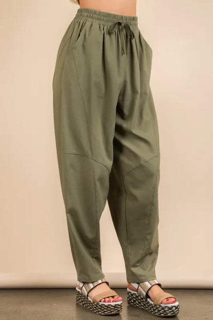 Trendy olive green boho woven pants for women with a relaxed fit and stylish design