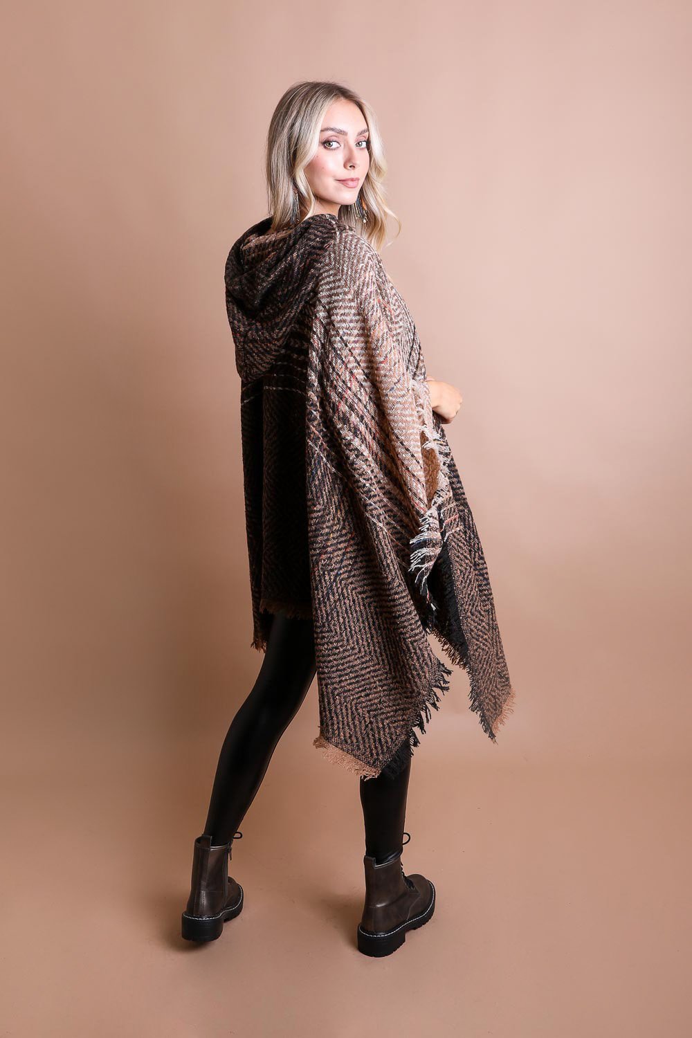 Stylish boho herringbone poncho from Leto Collection shown on model against a neutral backdrop