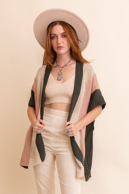 Leto Collection boho knit poncho for women in soft colors, perfect for layering over casual outfits