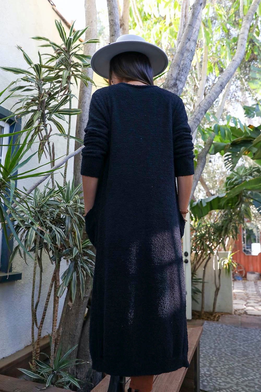 Leto Collection boho longline cardigan in dark color with pockets, perfect for layering in stylish outfits