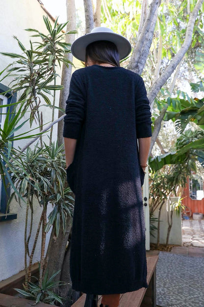 Leto Collection boho longline cardigan in dark color with pockets, perfect for layering in stylish outfits