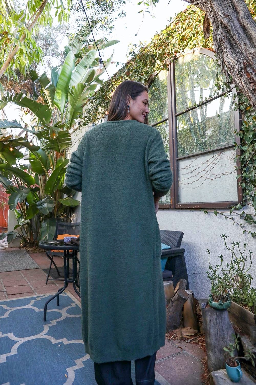 Leto Collection boho longline cardigan in green, perfect for layering in casual outfits
