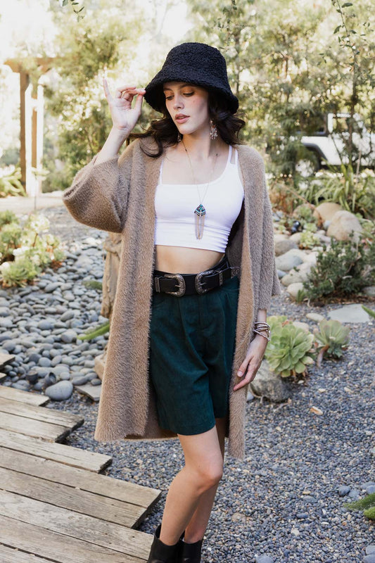 Leto Collection boho mohair knit cardigan worn over a white crop top with stylish accessories