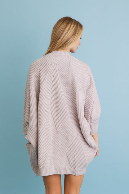 Leto Collection boho ribbed knit cardigan in soft pink with a stylish textured design
