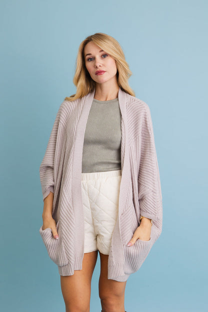 Leto Collection boho ribbed knit cardigan in light pink with loose fit and pockets for a comfortable look