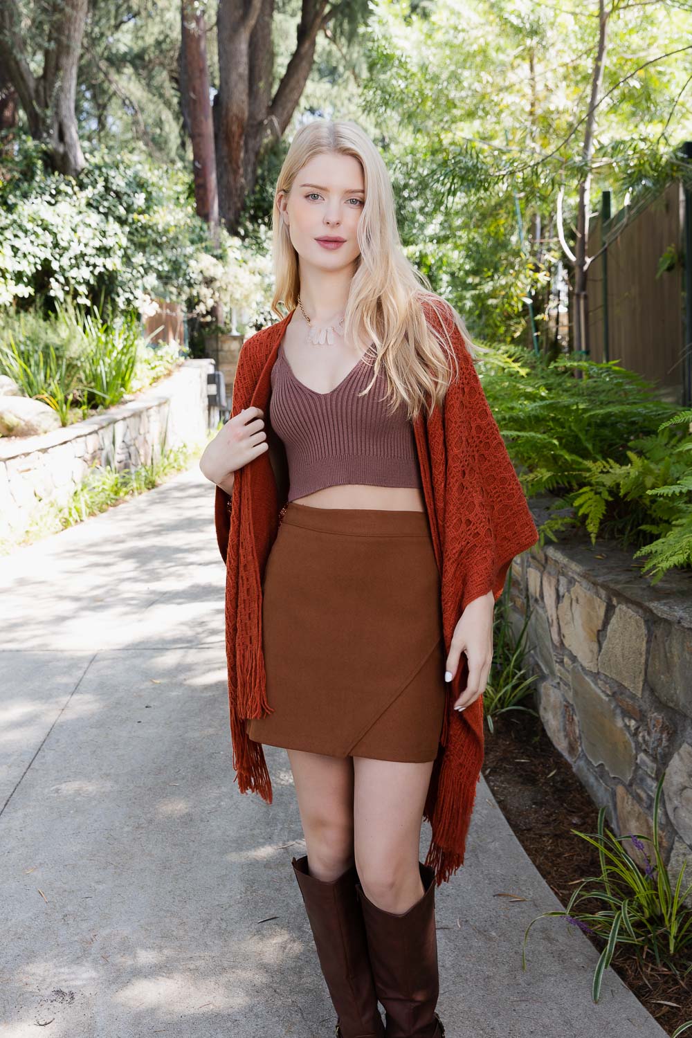Leto Collection boho tassel wrap in rust, perfect for layering in casual settings