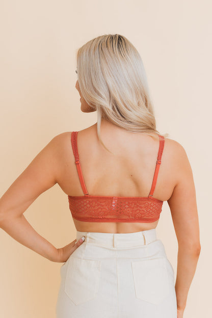 Back view of Leto Collection lace longline bralette in warm rust color with adjustable straps