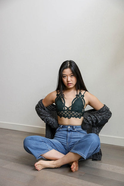 Leto Collection Boho Crochet Bralette in Green, styled with high-waisted jeans and a cozy cardigan