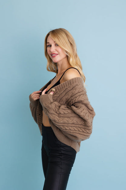 Leto Collection chunky cable knit cropped cardigan in brown, featuring a cozy oversized design