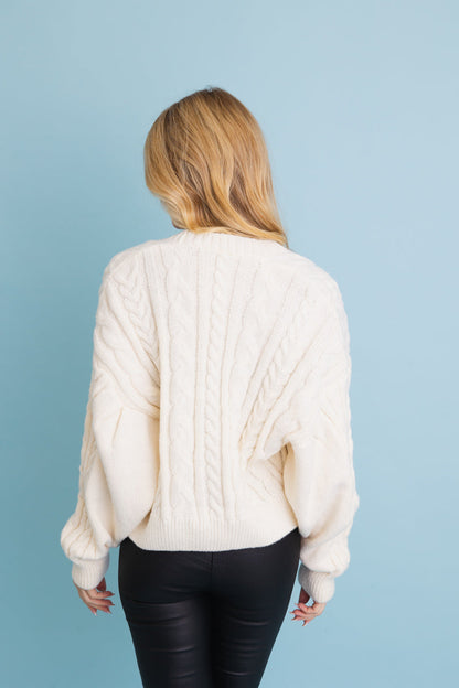 Leto Collection chunky cable knit cropped cardigan in white with a cozy design for stylish layering