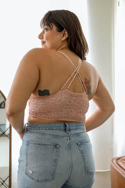 Back view of crochet daisy bralette in soft pink, featuring adjustable straps and a comfortable fit