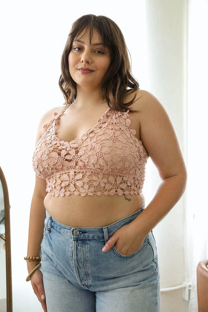 Leto Collection Crochet Daisy Bralette in soft pink, paired with high-waisted jeans for a stylish look