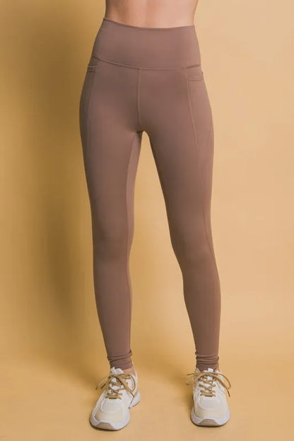 Brown high waist leggings with pockets for stylish and functional workouts