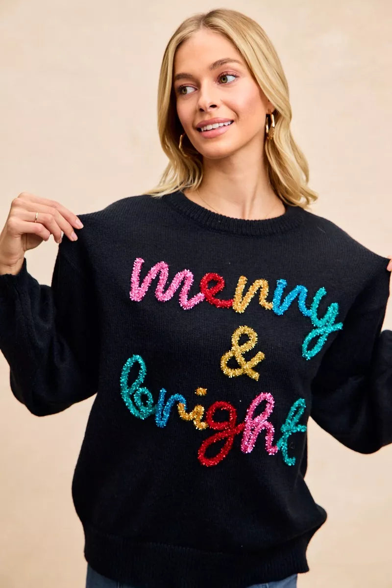 Women's black tinsel lettering Christmas sweater with colorful 'Merry & Bright' design