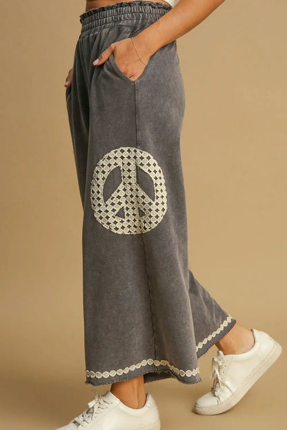 Trendsi plus size boho wide leg pants in gray featuring a peace symbol and side pockets