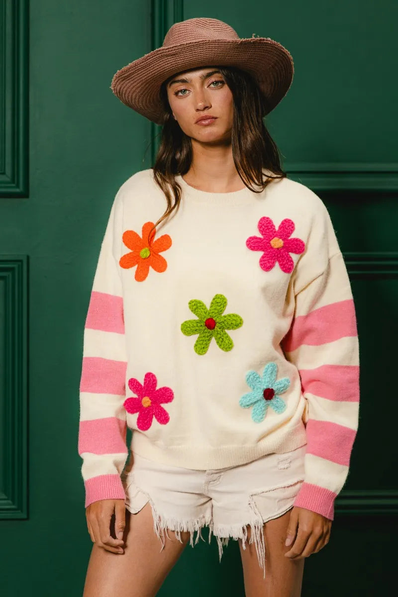 Trendy colorful floral sweater for women with oversized flowers and pink stripes