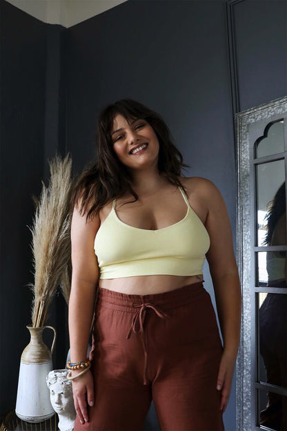 Plus size dream catcher bralette in soft yellow, paired with stylish brown pants for a trendy look