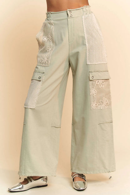 Lace patchwork adjustable pants in light green with stylish pockets and intricate lace details