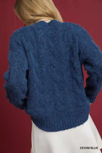 Denim blue cable knit cozy sweater with soft texture and relaxed fit for comfort and warmth