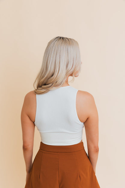 Back view of a Leto Collection boho ribbed crop top paired with a stylish skirt