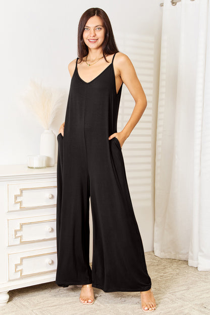 Trendy black boho wide leg jumpsuit with adjustable straps and pockets for a stylish look