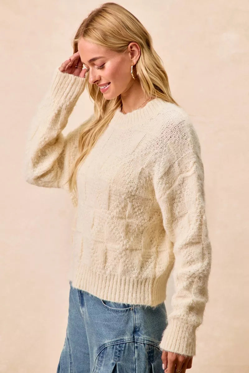 Trendsi checker board drop shoulder sweater in cream showcasing a cozy design for casual wear