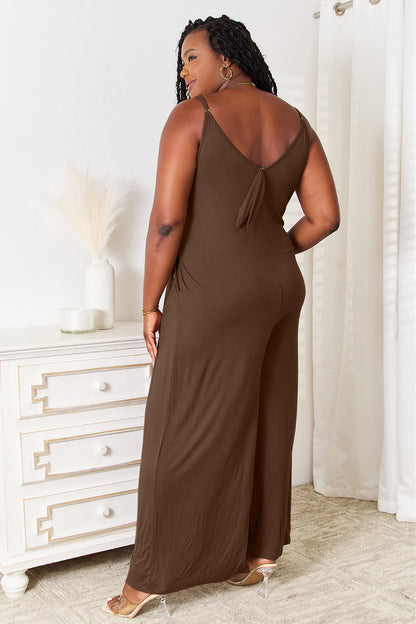 Back view of a brown boho wide leg jumpsuit with a stylish tie detail