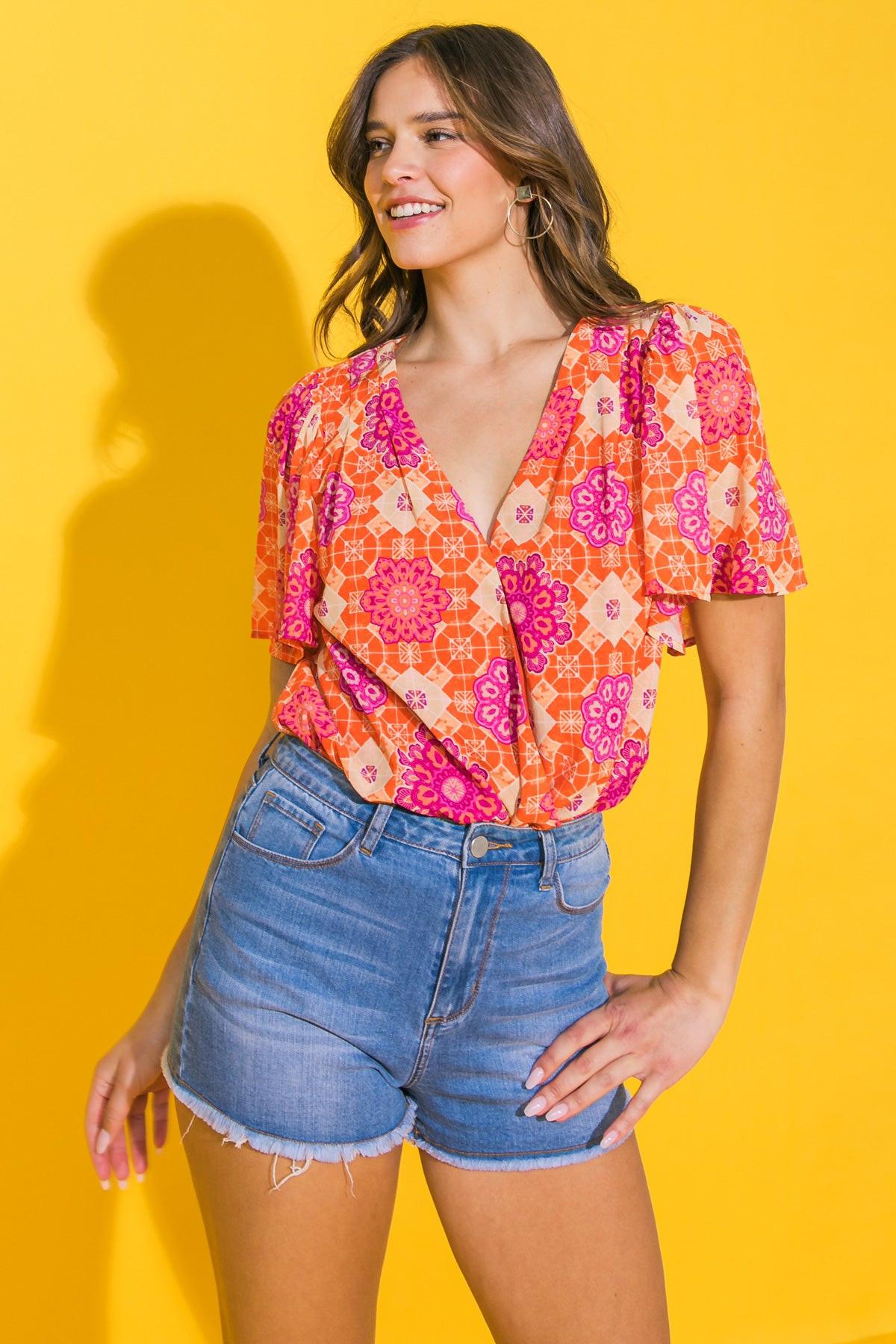 Printed Woven Bodysuit With Surplice Neckline And Snap Closure