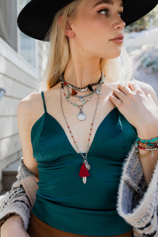 Leto Collection model wearing layered Boho Necklace, Boho Chic Jewelry, Spiritual necklaces with tassel pendant