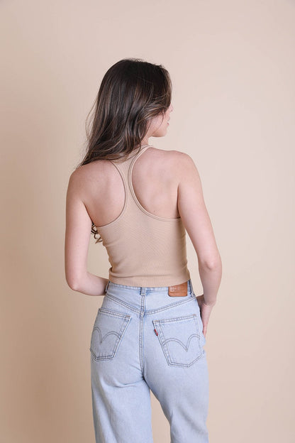 Back view of a Leto Collection high neck racerback brami in a neutral tone, styled with jeans