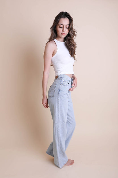 Leto Collection high neck racerback brami in white, styled with high-waisted light blue jeans