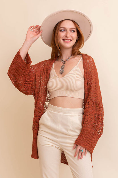 Leto Collection boho knit cardigan in rust color, styled with a tank top and wide-brimmed hat