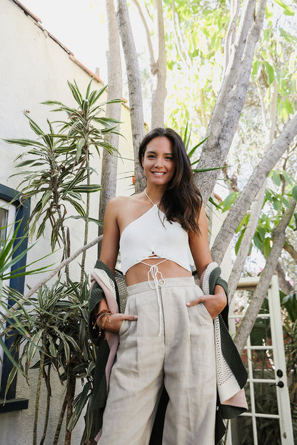 Leto Collection lace-up halter knit bralette paired with stylish wide-leg pants in a sunny outdoor setting