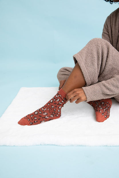 Leto Collection leopard knit socks in rust color, featuring a stylish leopard pattern and cozy fit