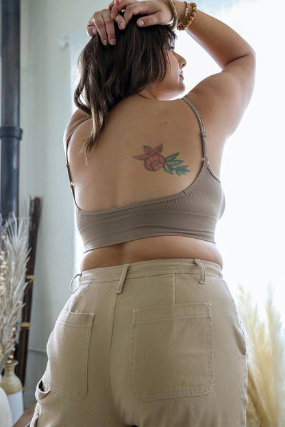 Plus size low back bralette in beige, featuring thin straps and a smooth back design