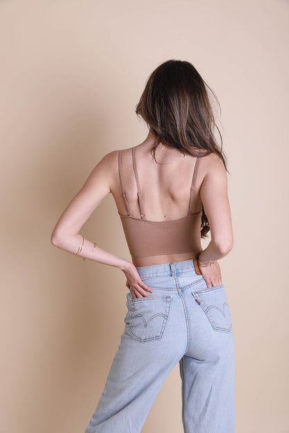 Back view of Leto Collection boho offset shoulder brami top paired with high-waisted jeans
