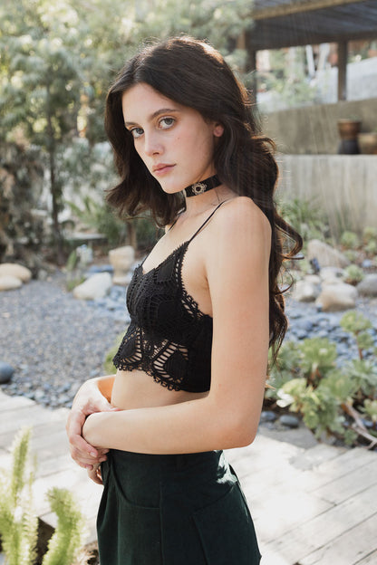 Leto Collection Boho Crochet Bralette in black showcasing intricate lace design and adjustable straps