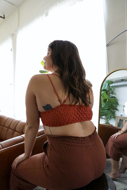 Plus size crochet bralette in rust color featuring adjustable straps and a stylish back design
