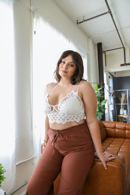 Leto Collection plus size crochet bralette with delicate lace detailing, paired with casual pants