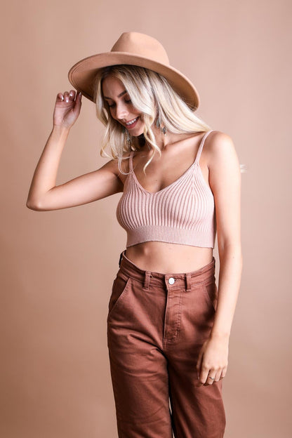 Leto Collection Rib Knit Brami Top in pink, styled with high-waisted trousers and a fashionable hat