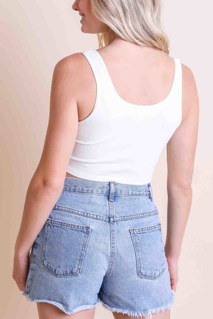 Leto Collection ribbed hook eye brami top in white, paired with high-waisted denim shorts